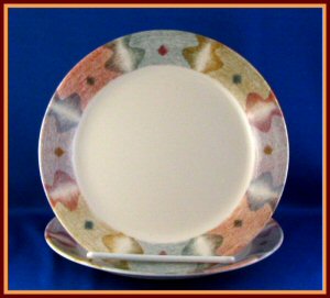   is mirage by corelle the pattern features a beige background and a